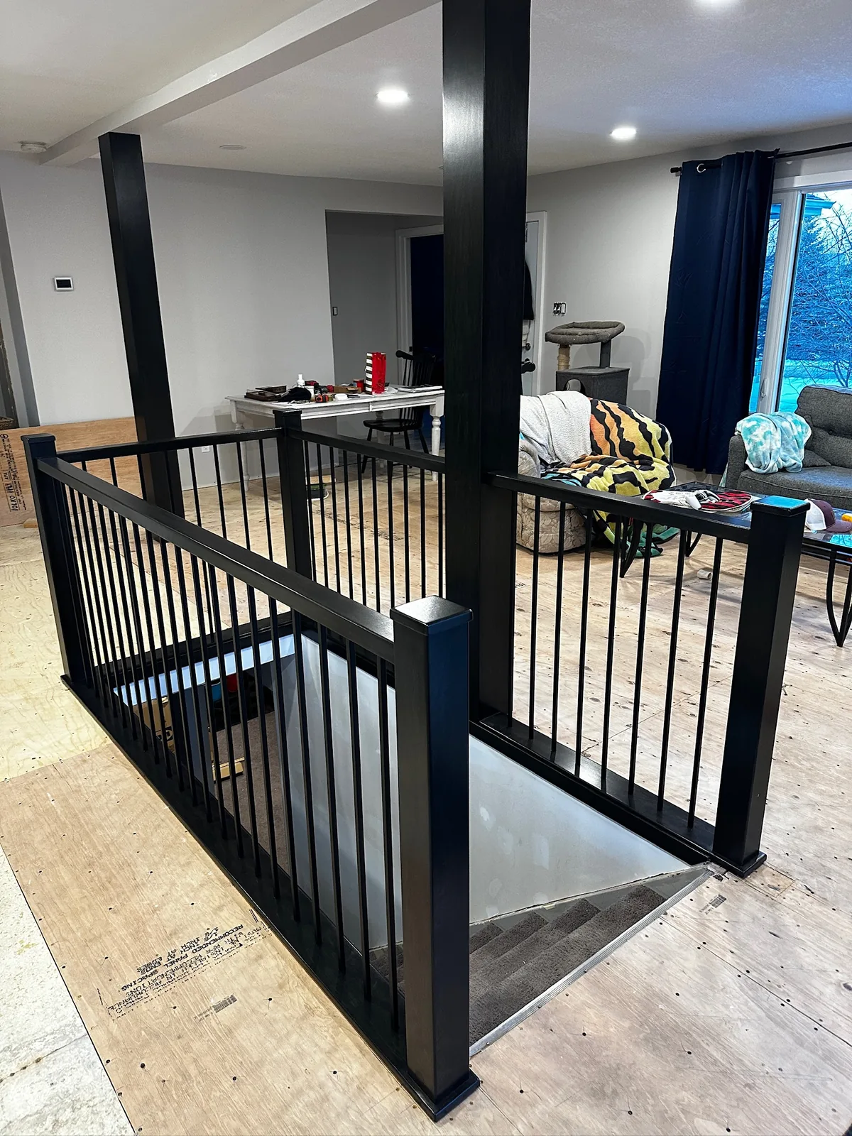 Custom staircase and railing built by Ben's Carpentry in the Edmonton area
