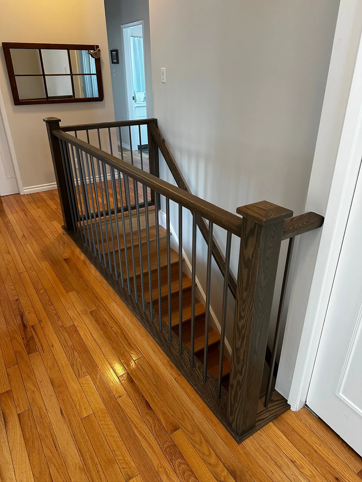 Custom staircase and railing built by Ben's Carpentry in the Edmonton area