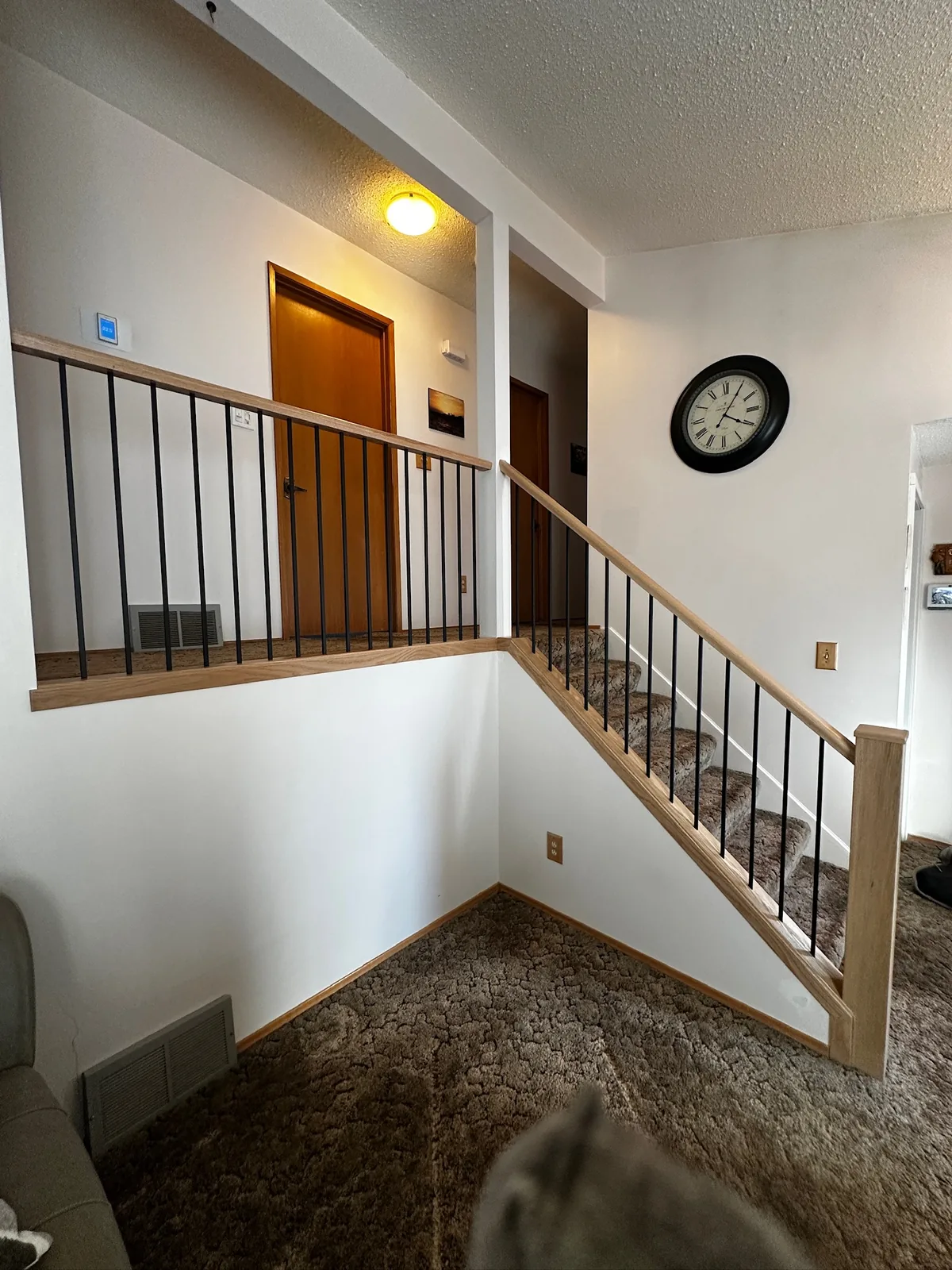 Custom staircase and railing built by Ben's Carpentry in the Edmonton area