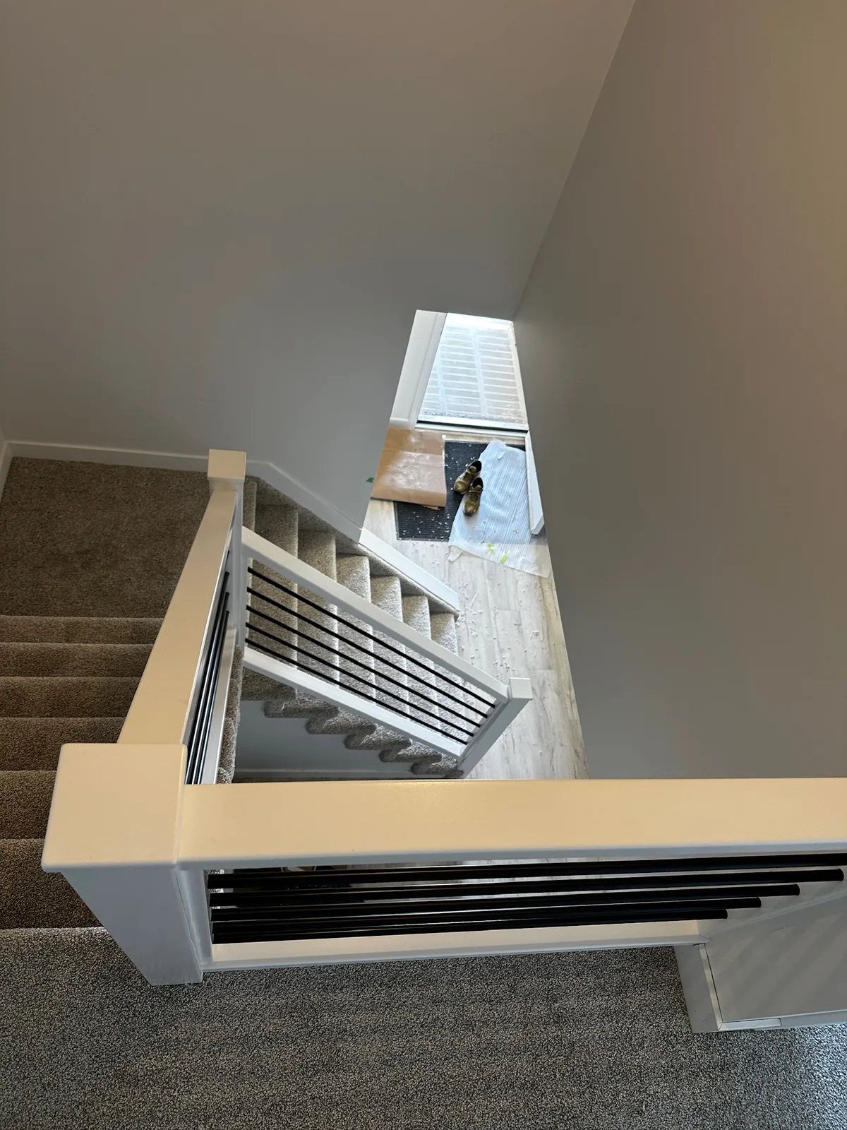 Custom staircase and railing built by Ben's Carpentry in the Edmonton area