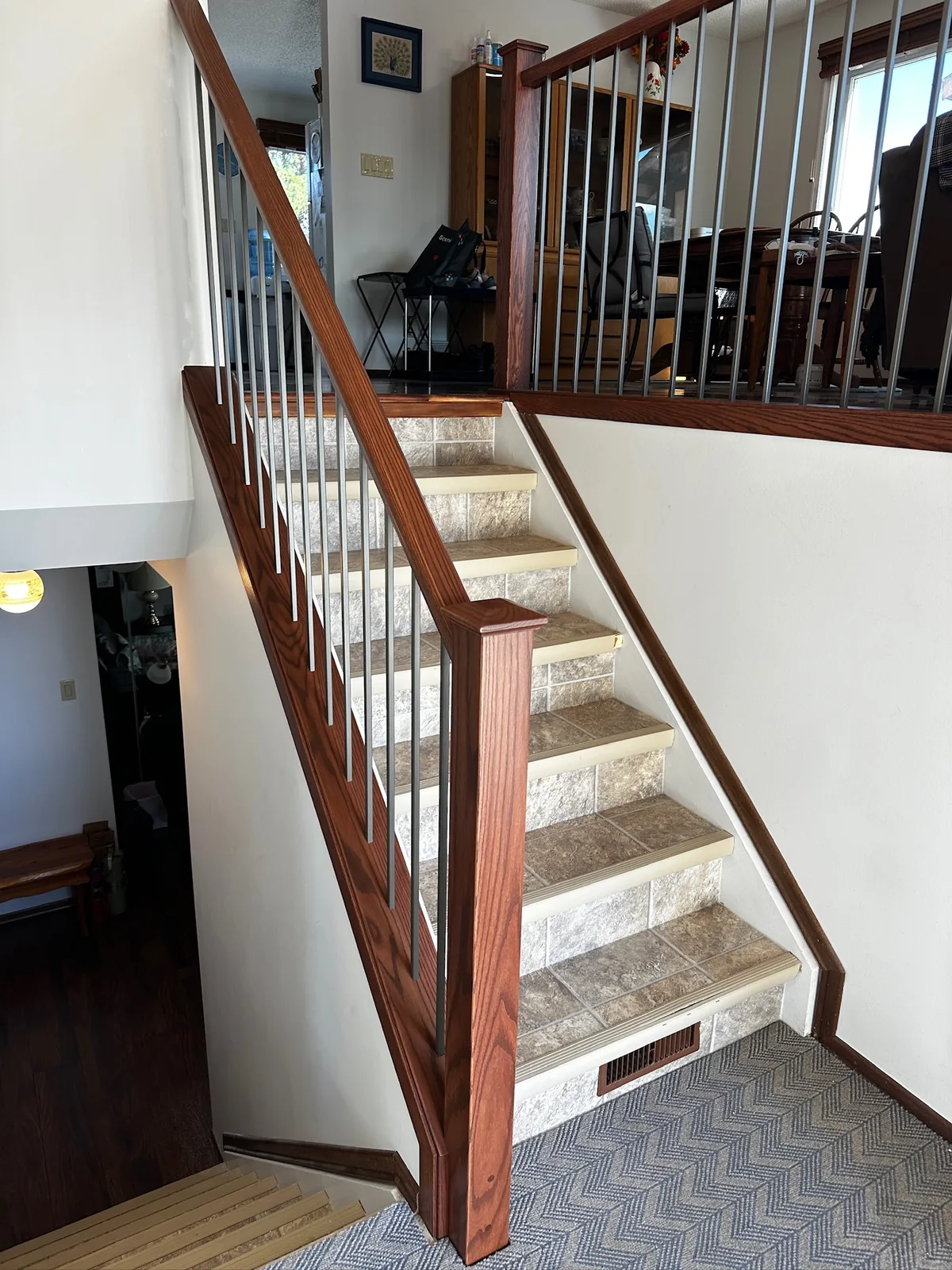 Custom staircase and railing built by Ben's Carpentry in the Edmonton area