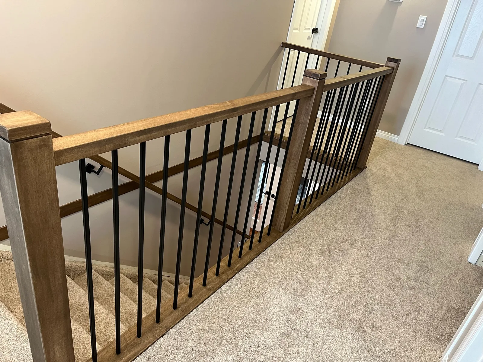 Custom staircase and railing built by Ben's Carpentry in the Edmonton area