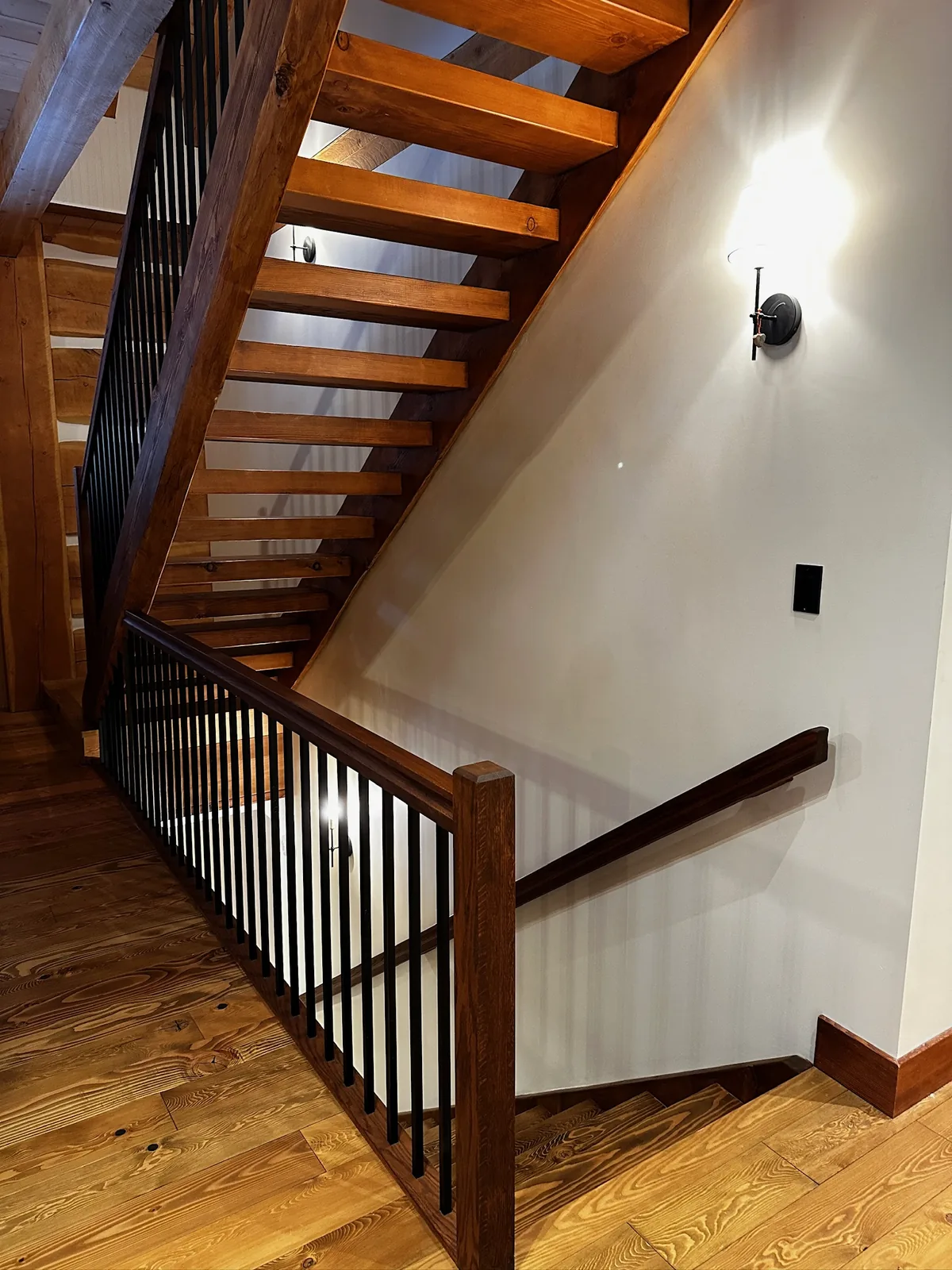 Custom staircase and railing built by Ben's Carpentry in the Edmonton area
