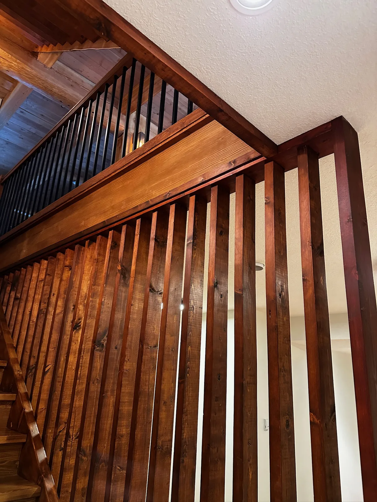 Custom staircase and railing built by Ben's Carpentry in the Edmonton area