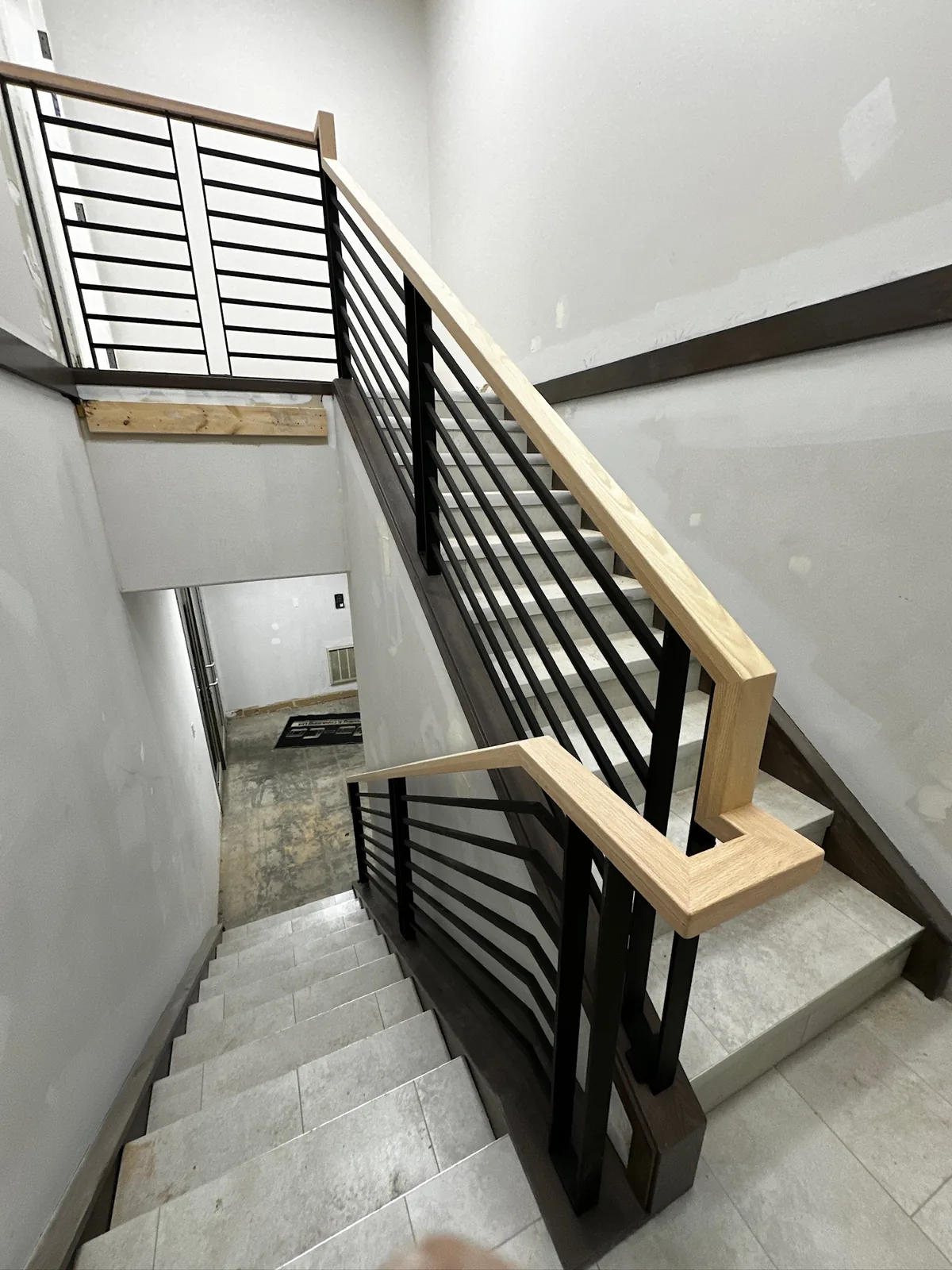 Custom staircase and railing built by Ben's Carpentry in the Edmonton area