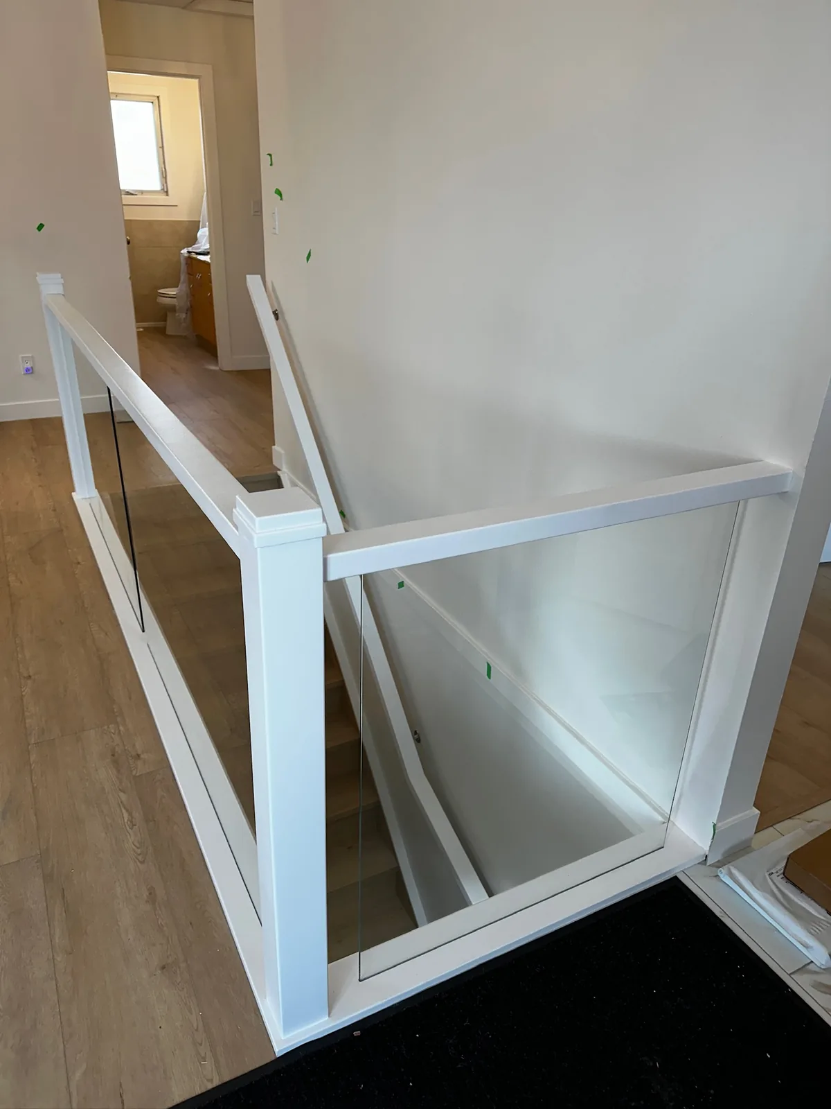 Custom staircase and railing built by Ben's Carpentry in the Edmonton area