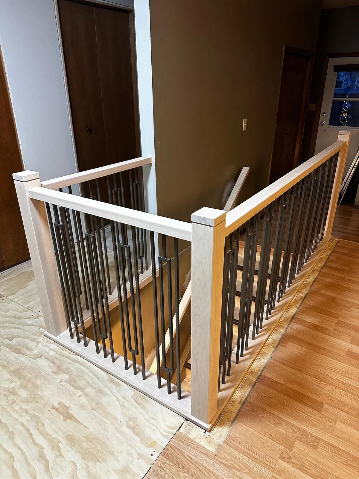 Custom staircase and railing built by Ben's Carpentry in the Edmonton area