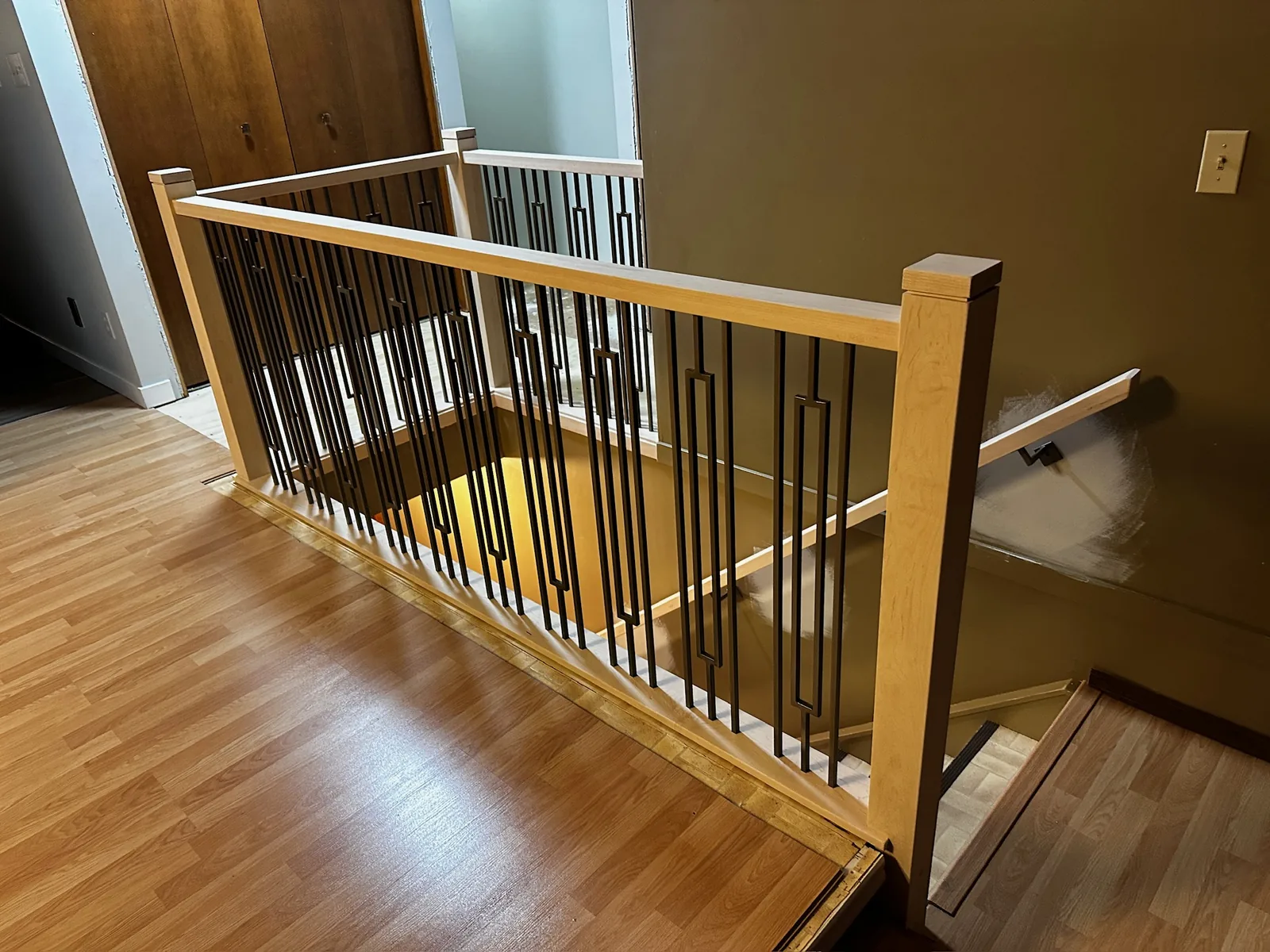 Custom interior spindle railing built for an Edmonton staircase