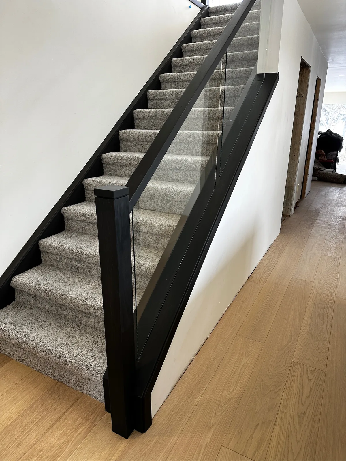 Custom staircase and railing built by Ben's Carpentry in the Edmonton area
