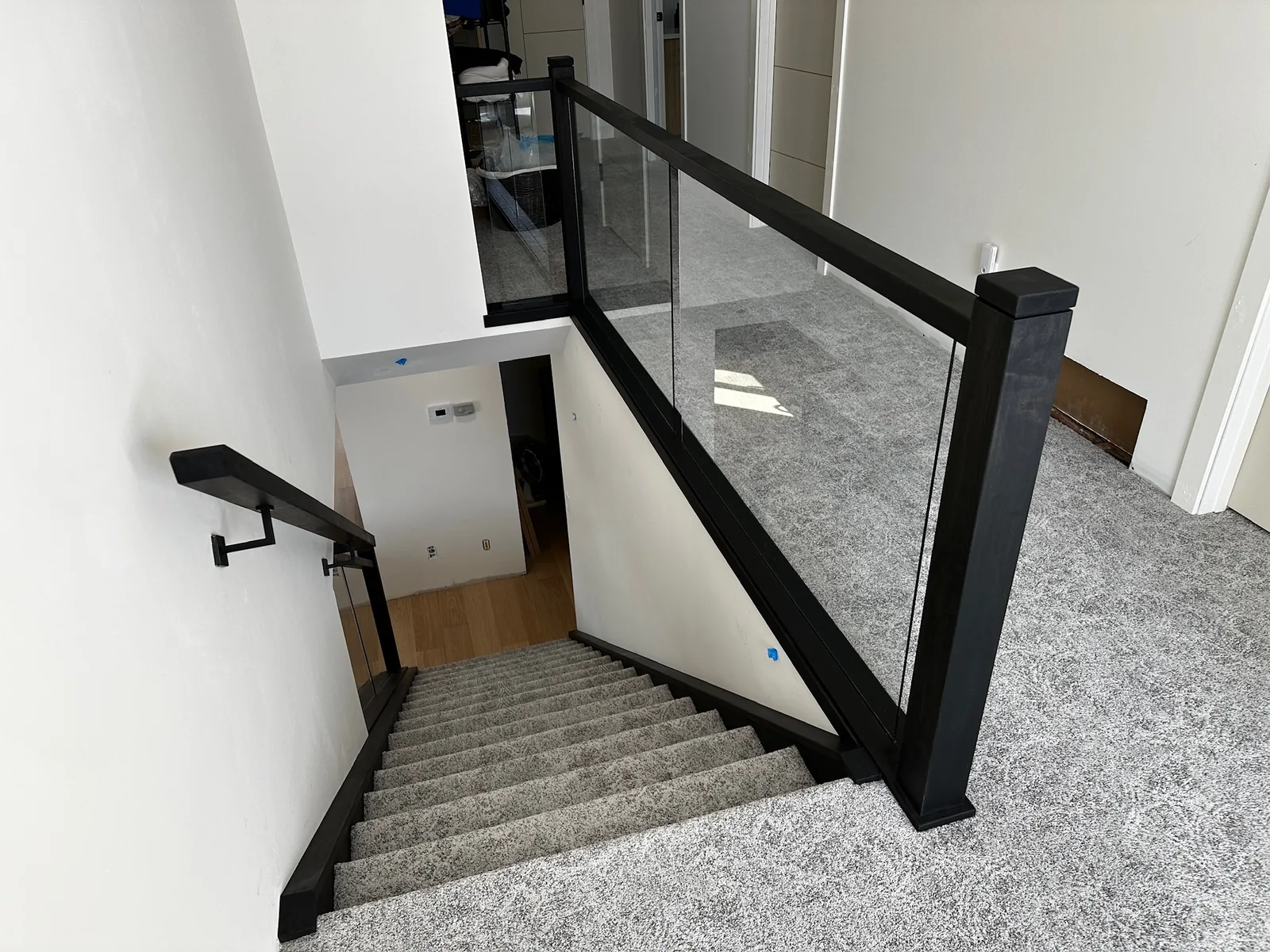 Custom staircase and railing built by Ben's Carpentry in the Edmonton area