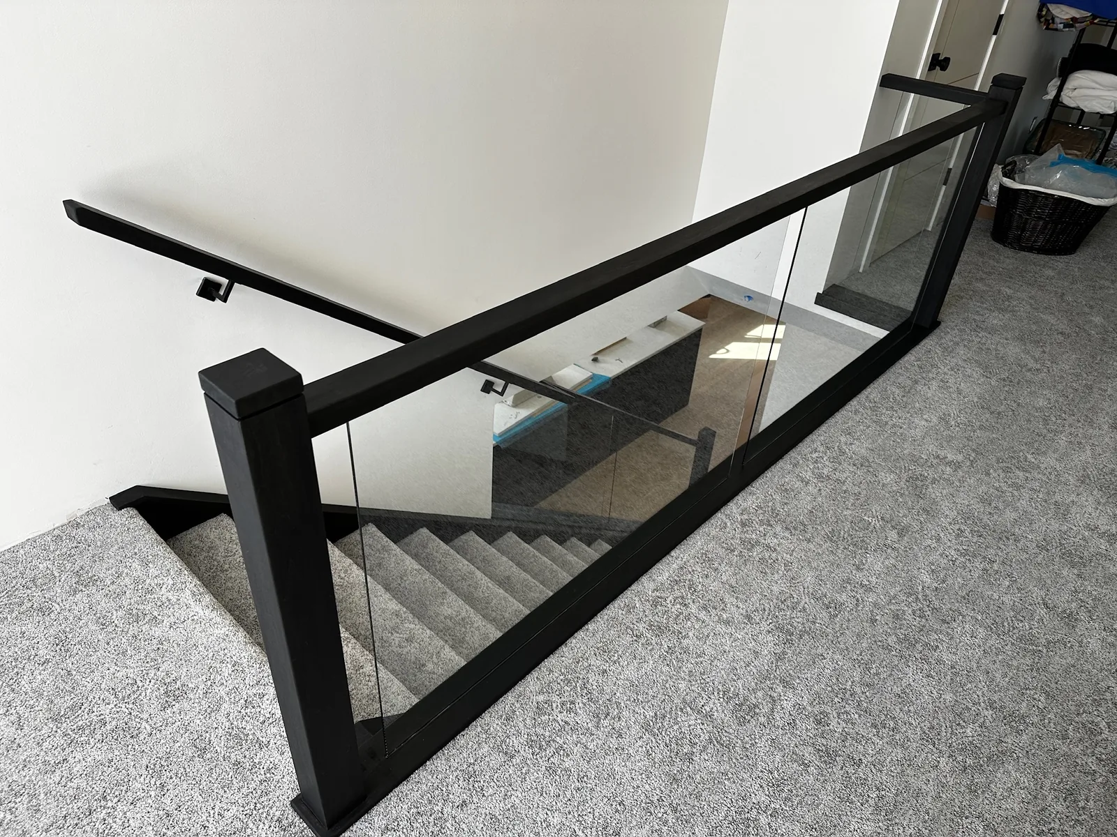 Custom staircase and railing built by Ben's Carpentry in the Edmonton area