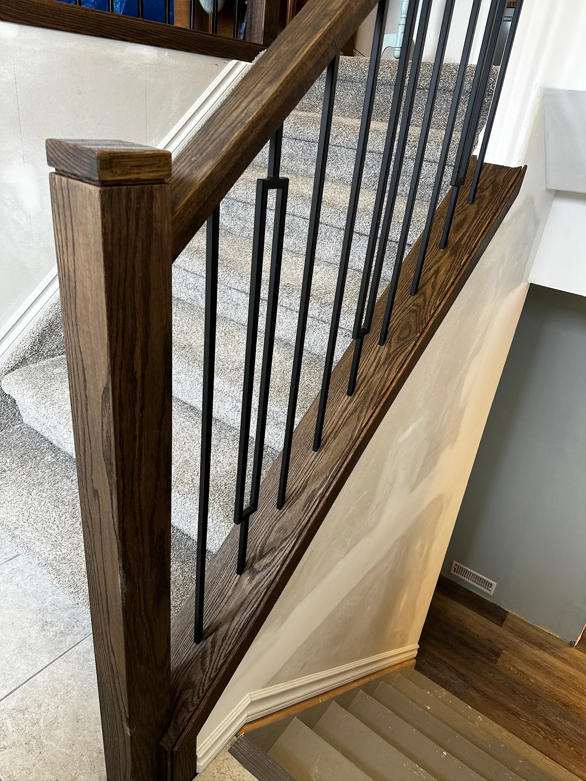 Custom staircase and railing built by Ben's Carpentry in the Edmonton area