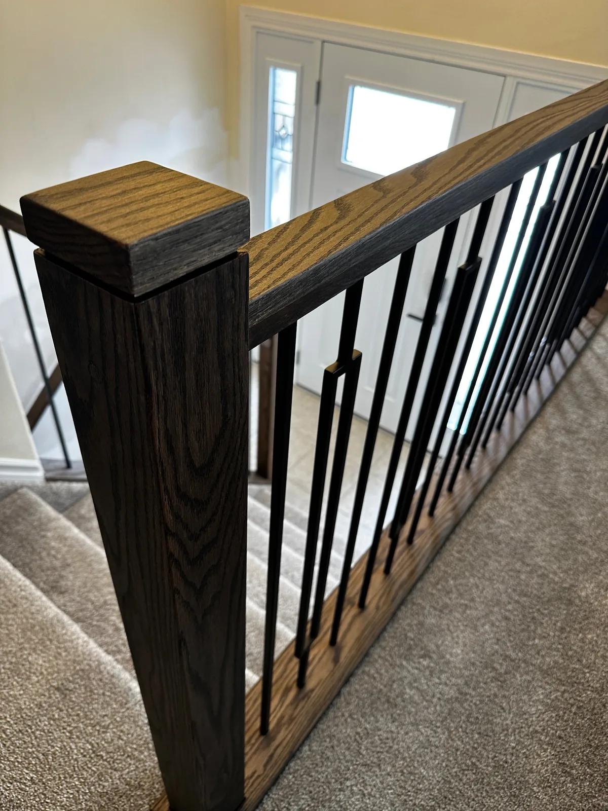 Custom staircase and railing built by Ben's Carpentry in the Edmonton area