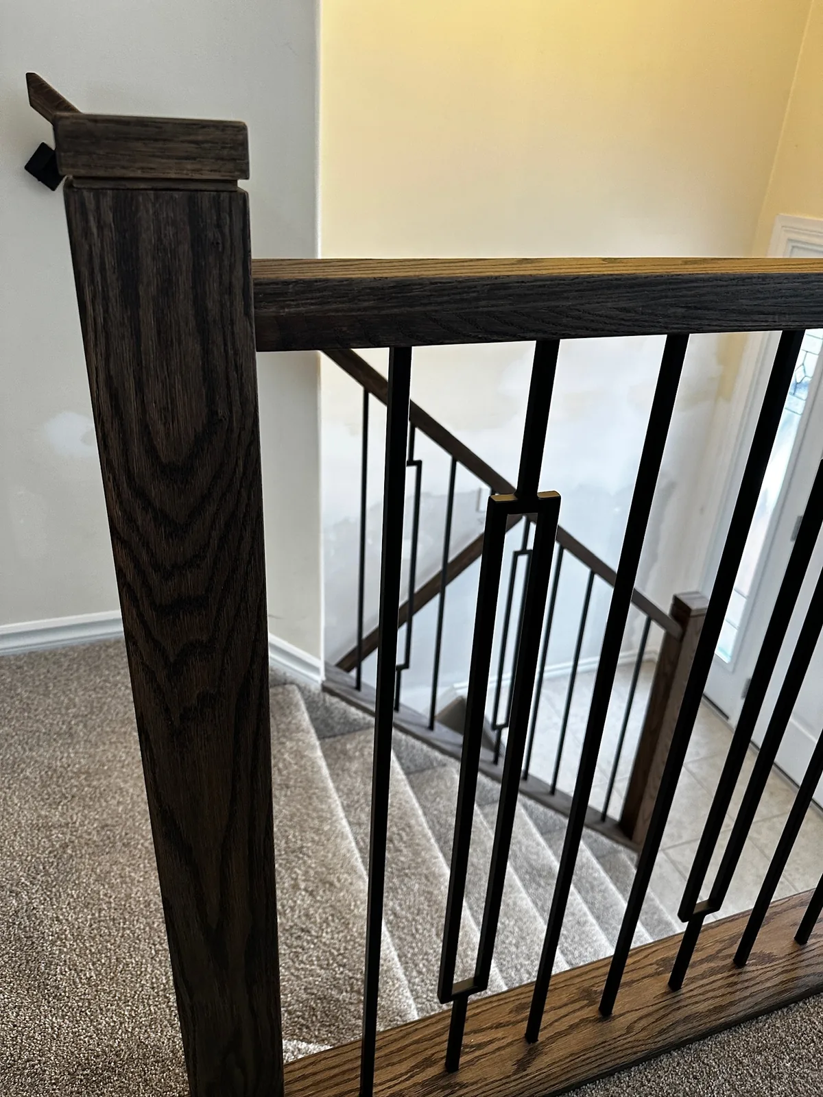 Custom staircase and railing built by Ben's Carpentry in the Edmonton area