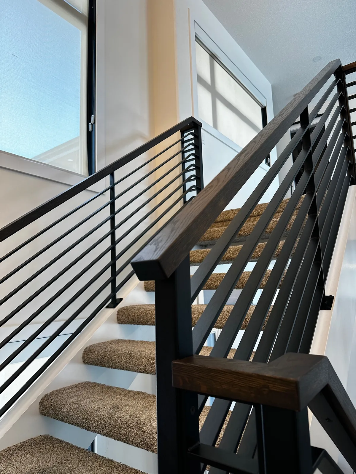 Custom staircase and railing built by Ben's Carpentry in the Edmonton area