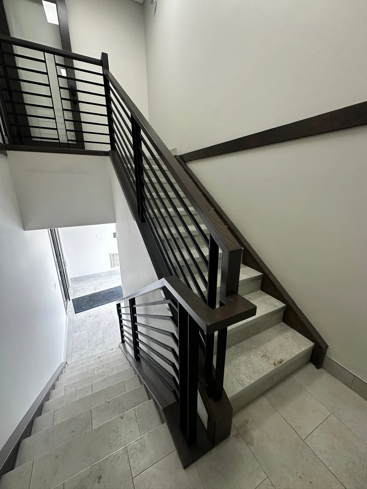 Custom staircase and railing built by Ben's Carpentry in the Edmonton area