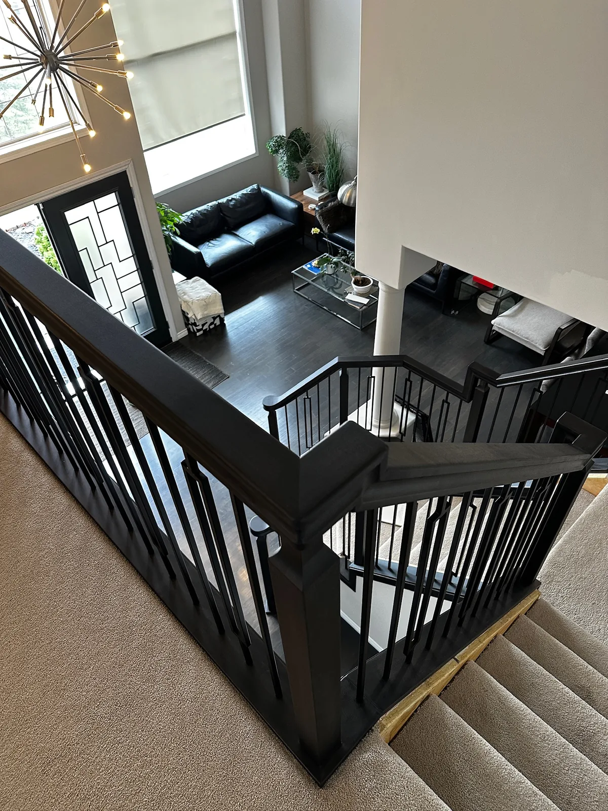Custom staircase and railing built by Ben's Carpentry in the Edmonton area