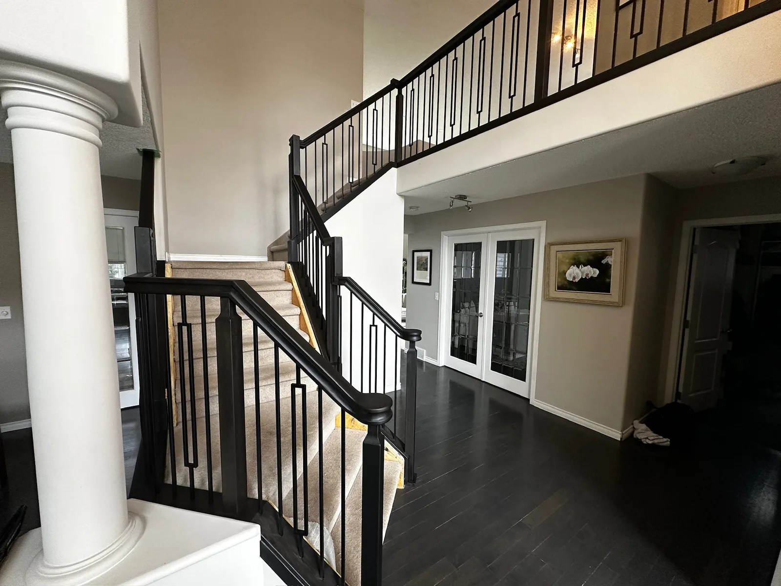 Custom staircase and railing built by Ben's Carpentry in the Edmonton area